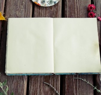 Photograph of Blank Sketchbook and Paint Brushes